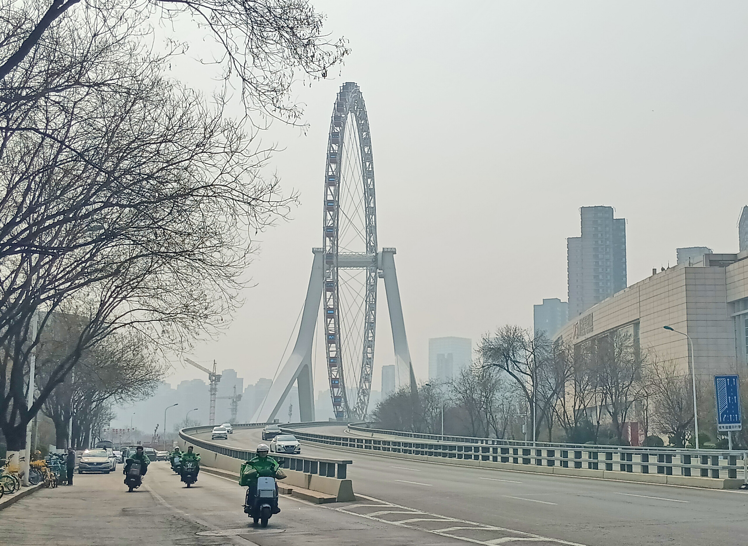 Tianjin Eye (Ferris wheel) on the Yongle Bridge, China