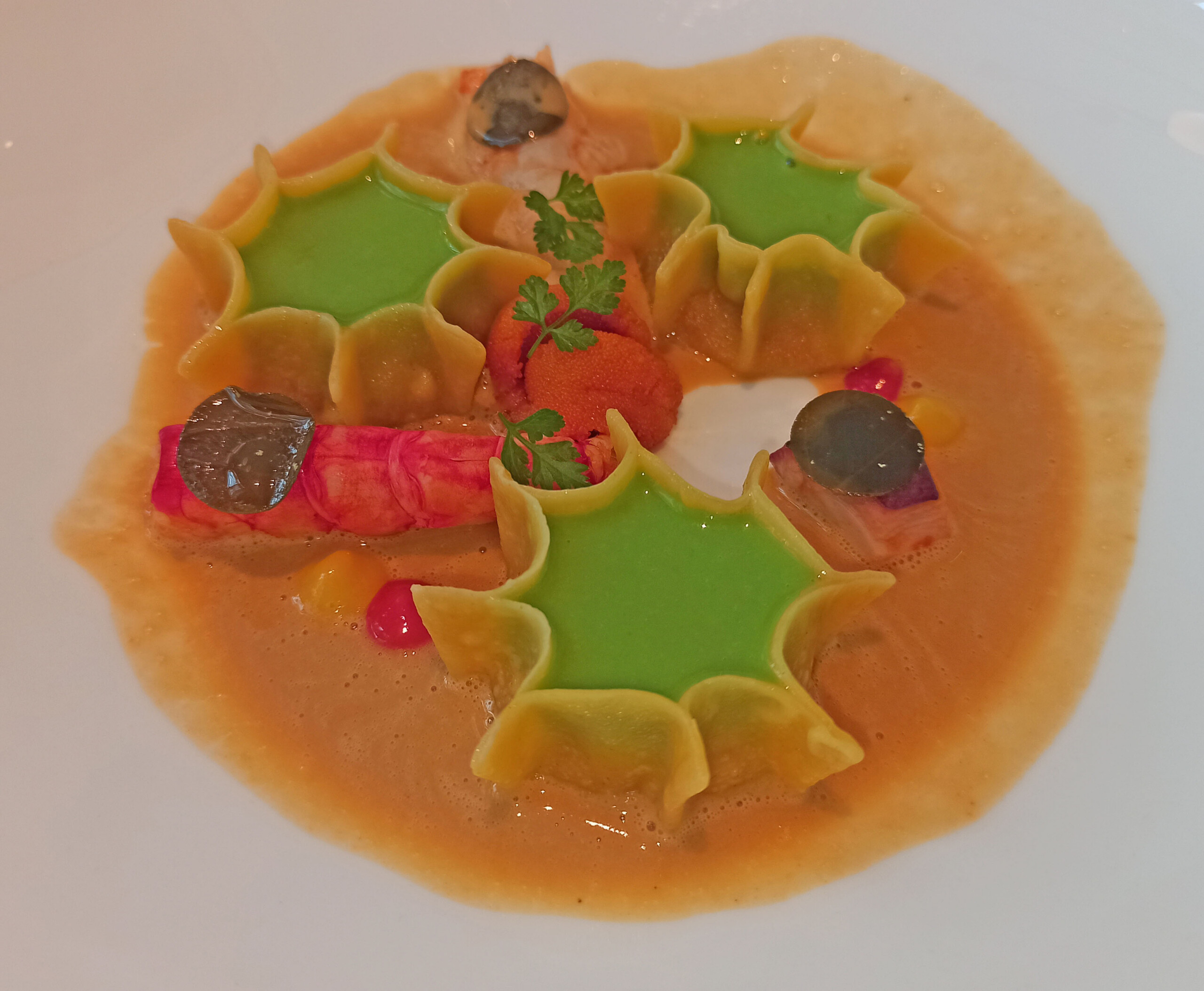 Tortelli allo Scoglio: Tortelli Filled with Seafood, Lettuce Sauce, Pepper, Brown Crab Broth