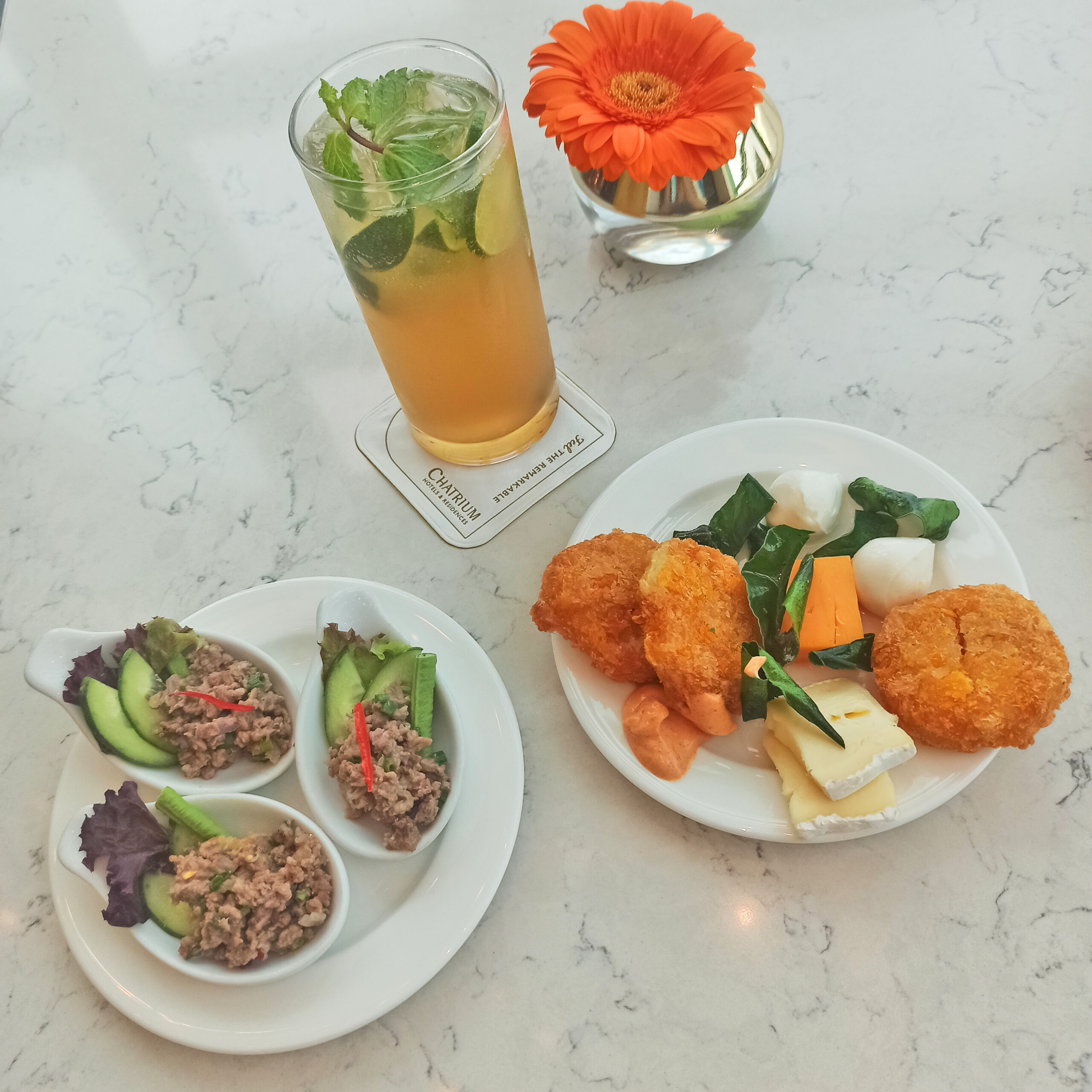 Club Lounge Shrimp fritters and ground beef with a mojito
