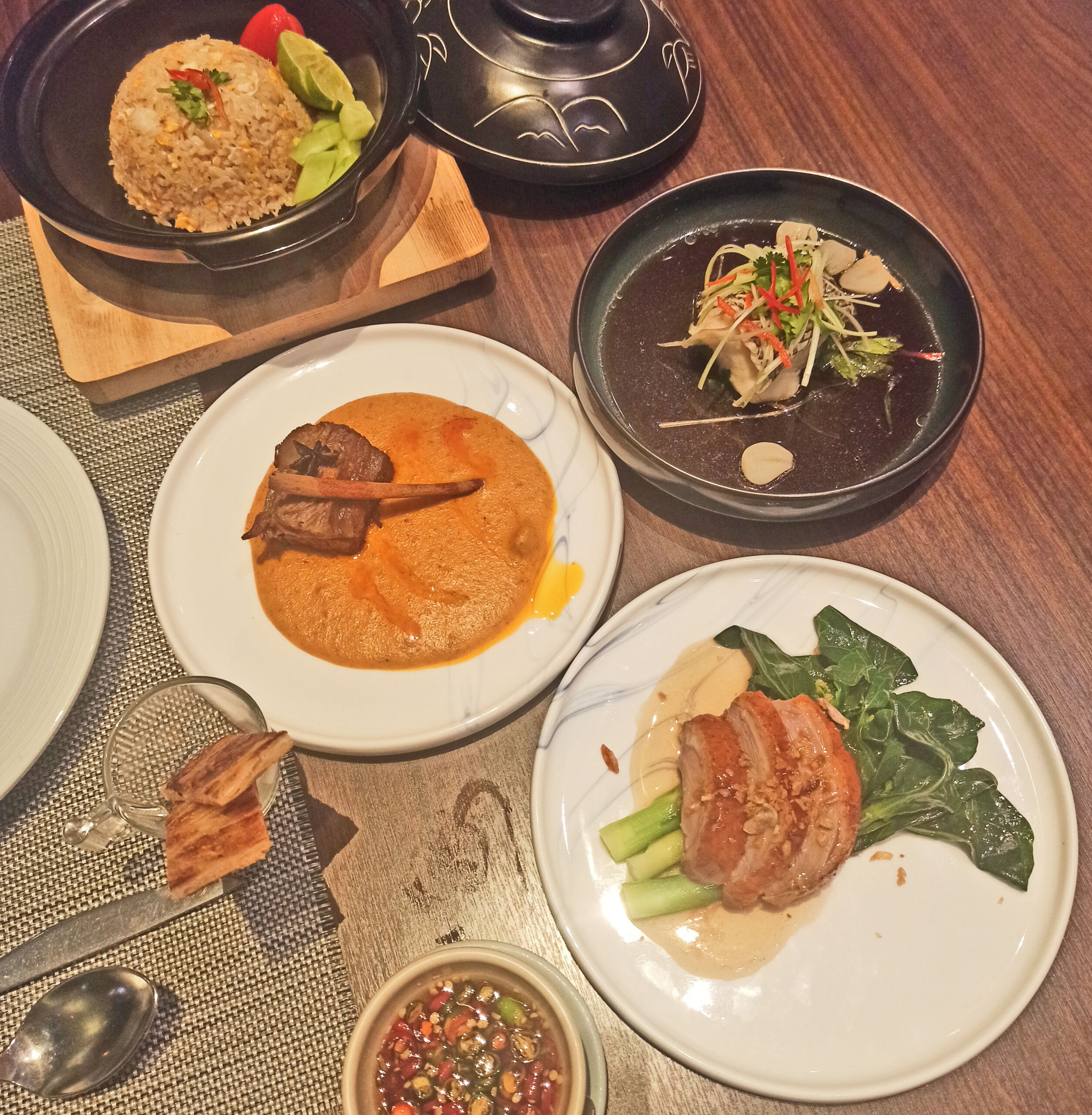 Slow Braised Short Rib Massaman with Roti Steamed Snow Fish Medallion with Ginger and Pickled Garlic Herb Roasted Duck with Hong Kong Kale and Abalone Essence Lump Crab Meat Fried Rice